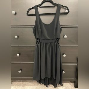 Black dress. Longer in back, with cut outs on the sides. Size small. Worn once.